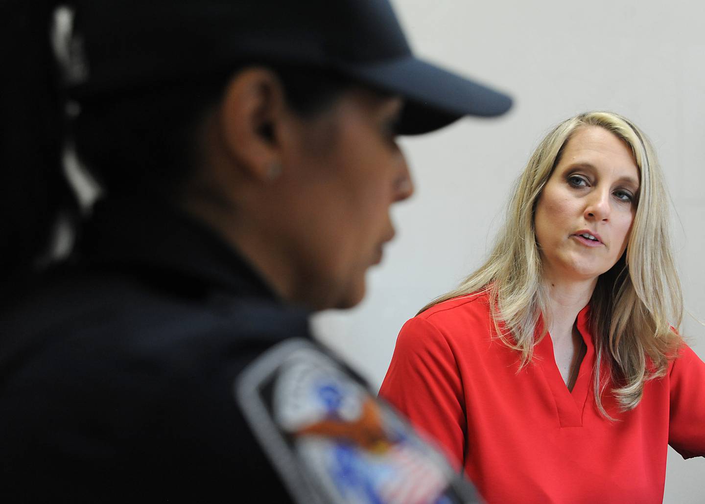 McHenry County Sheriff's Office social worker Amy Kristufek listens to Crystal Lake police officer Ingrid Pinto talk about a mental health case she has on Thursday, June 16, 2022, in a conference room at the Crystal Lake Police Department. The social workers are part of the sheriff's office new social worker program. Social workers were hired to help police in situations involving mental health crisis. They go out on calls sometimes and follow up in the days, weeks and months that follow to help a person get to the resources they need.