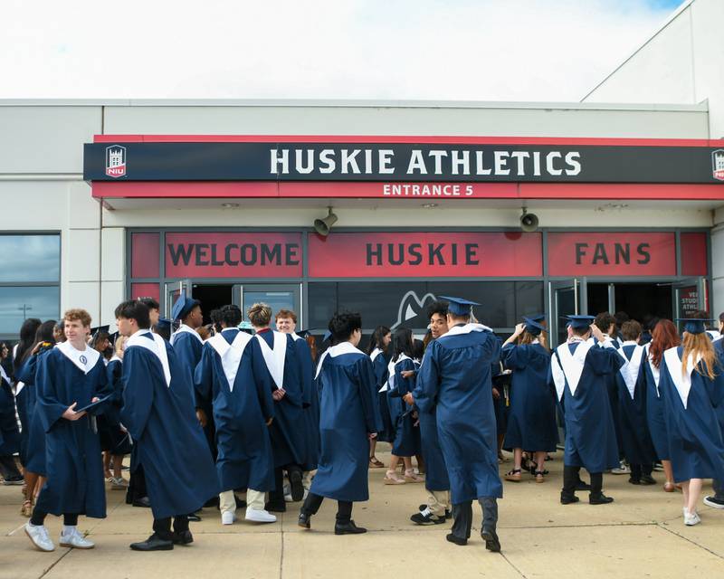 Oswego East graduates wait to enter the Convocation Center in DeKalb on Saturday May 17, 2025, before the start of commencement.