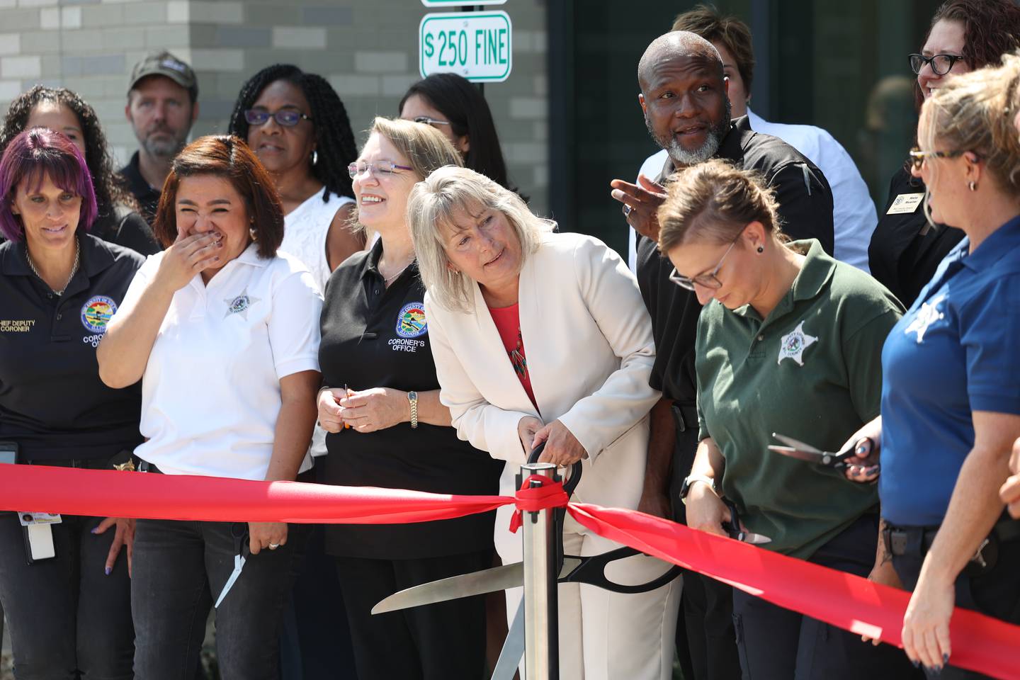 Laurie Summers, Will County Coroner, center, stands with her staff at the ribbon cutting ceremony for the new Will County Coroner Facility on Tuesday, July 18th, 2023 in Joliet.