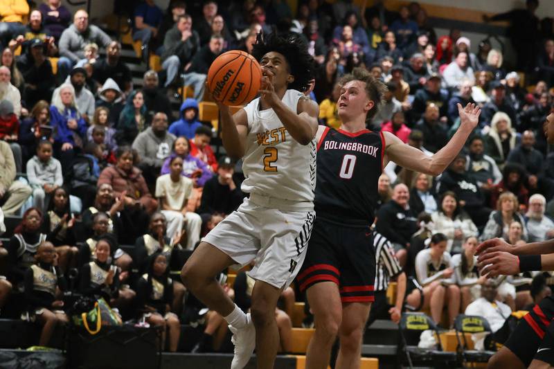 Joliet West’s Nasir Sears goes in for the basket against Bolingbrook on Friday, Jan 24, 2025 in Joliet.
