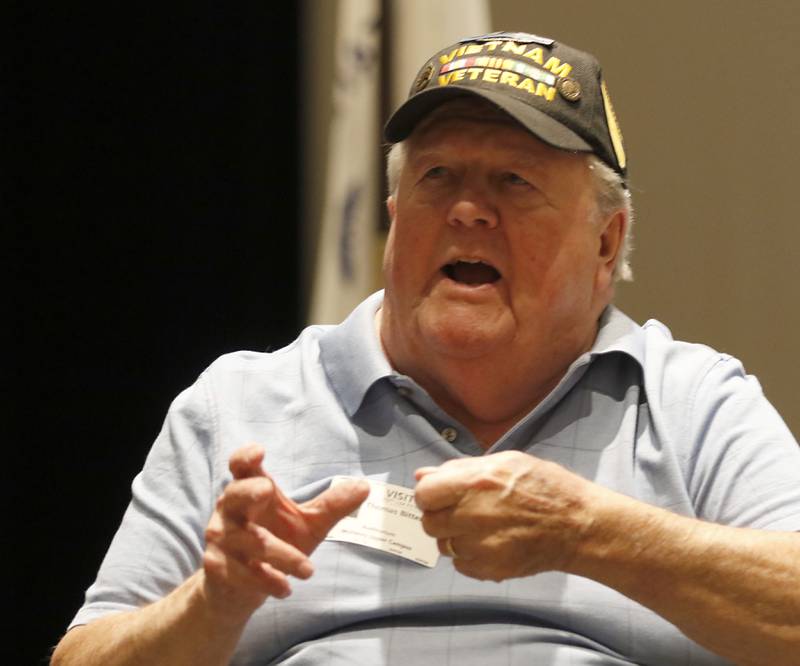 U. S. Army veteran Tom Bitterman, who served as an Infantry Platoon Sergeant with the 1st Cavalry Division in Vietnam, talks about his service during the Veterans Day event on Monday, Nov.11, 2023, at the Upper Campus of McHenry High School.
