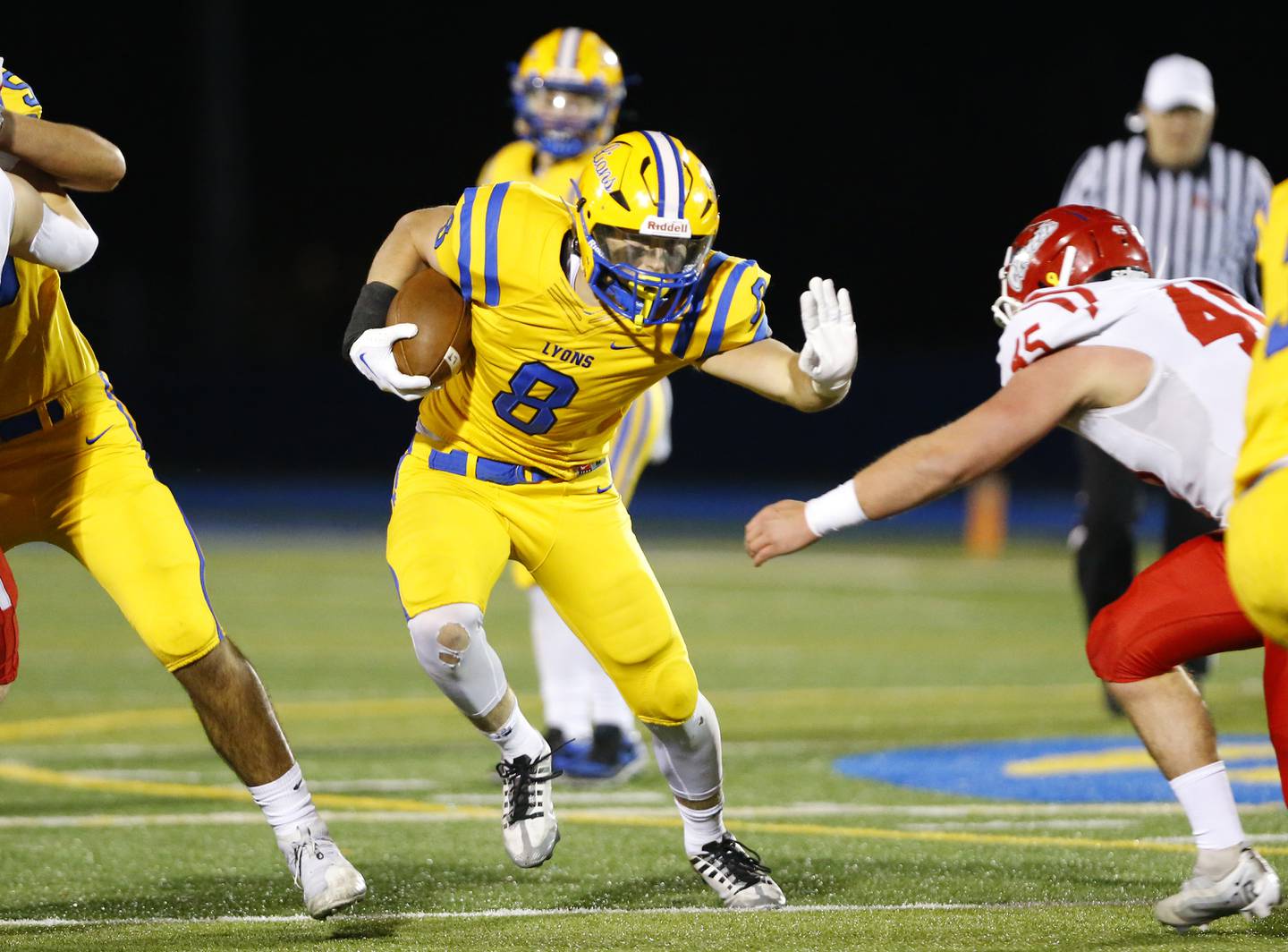 Lyons' Danny Pasko (8) runs the ball against Naperville Central during a first round Class 8A varsity football playoff game between Lyons Township and Naperville Central on Friday, Oct. 28, 2022 in Western Springs, IL.