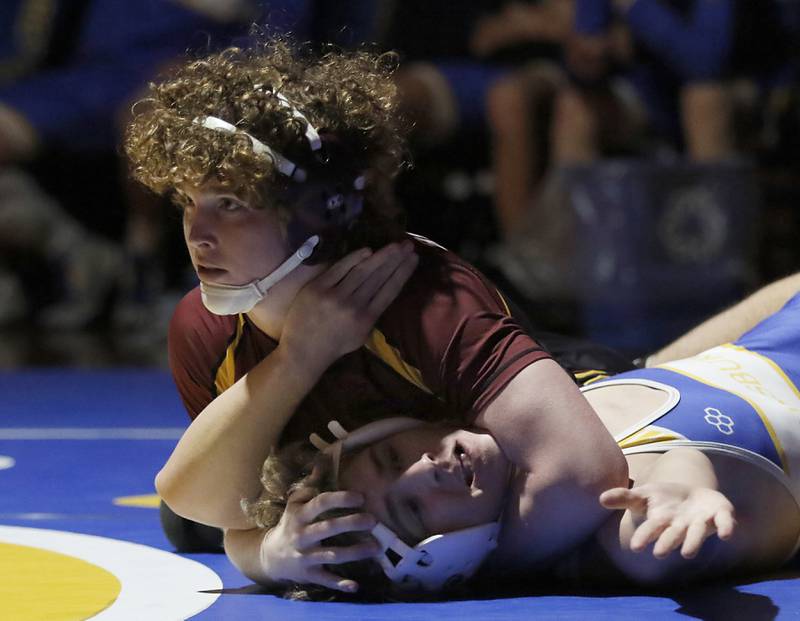 Richmond-Burton’s Maxwell Martin tries to pin Johnsburg’s Drew Jesuit in the 157-pound match of a Kishwaukee River Conference wrestling meet on Thursday, Jan. 30, 2025, at Johnsburg High School.