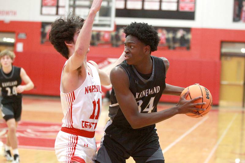 Kaneland's Jeffrey Hassan looks to pass the ball around Naperville Central's Casey Cooperkawa during a game on Tuesday, Jan. 14, 2025 in Naperville.