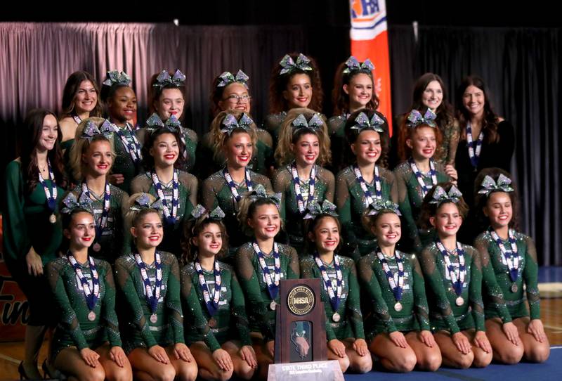Members of the Grayslake Central cheerleading team celebrate their third-place finish in the medium team division of the IHSA State Finals on Saturday, Feb. 8, 2025 at Grossinger Motors Arena in Bloomington.