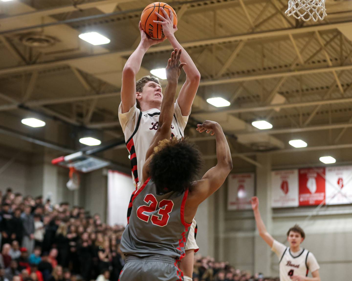 Benet's Colin Stack (42) goes in for a layup during their When Sides Collide Shootout basketball matchup between Rich Township at Benet Academy. Jan 25, 2025 in Lisle.