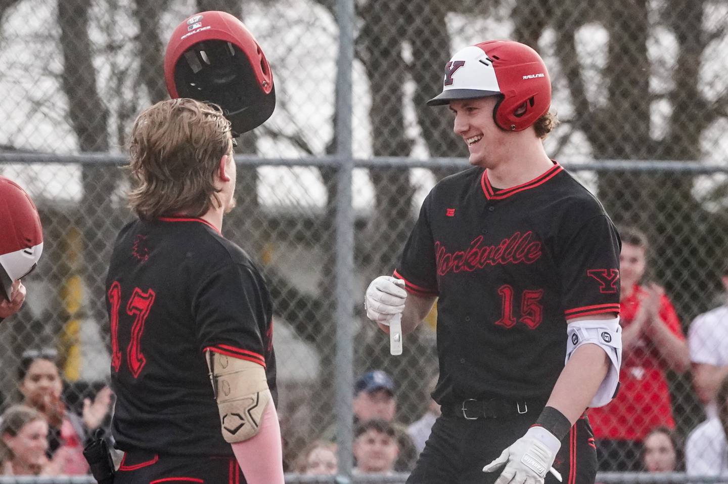 Yorkville's Nate Harris (15) smiles as he crosses home plate after hitting a two run homer against Lincoln-Way Central during a baseball game at Yorkville High School on Tuesday, March 12, 2024.