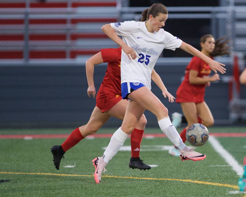 St. Charles North's Kaitlin Glenn kicks the ball against Batavia on Thursday, April 17,2025 in Batavia.
