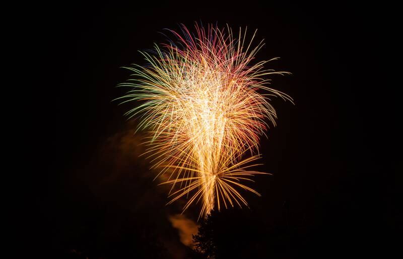 Attendees gathered to watch fireworks during North Aurora's annual Independence Day celebration at Riverfront Park in North Aurora on Monday, July 3, 2023.