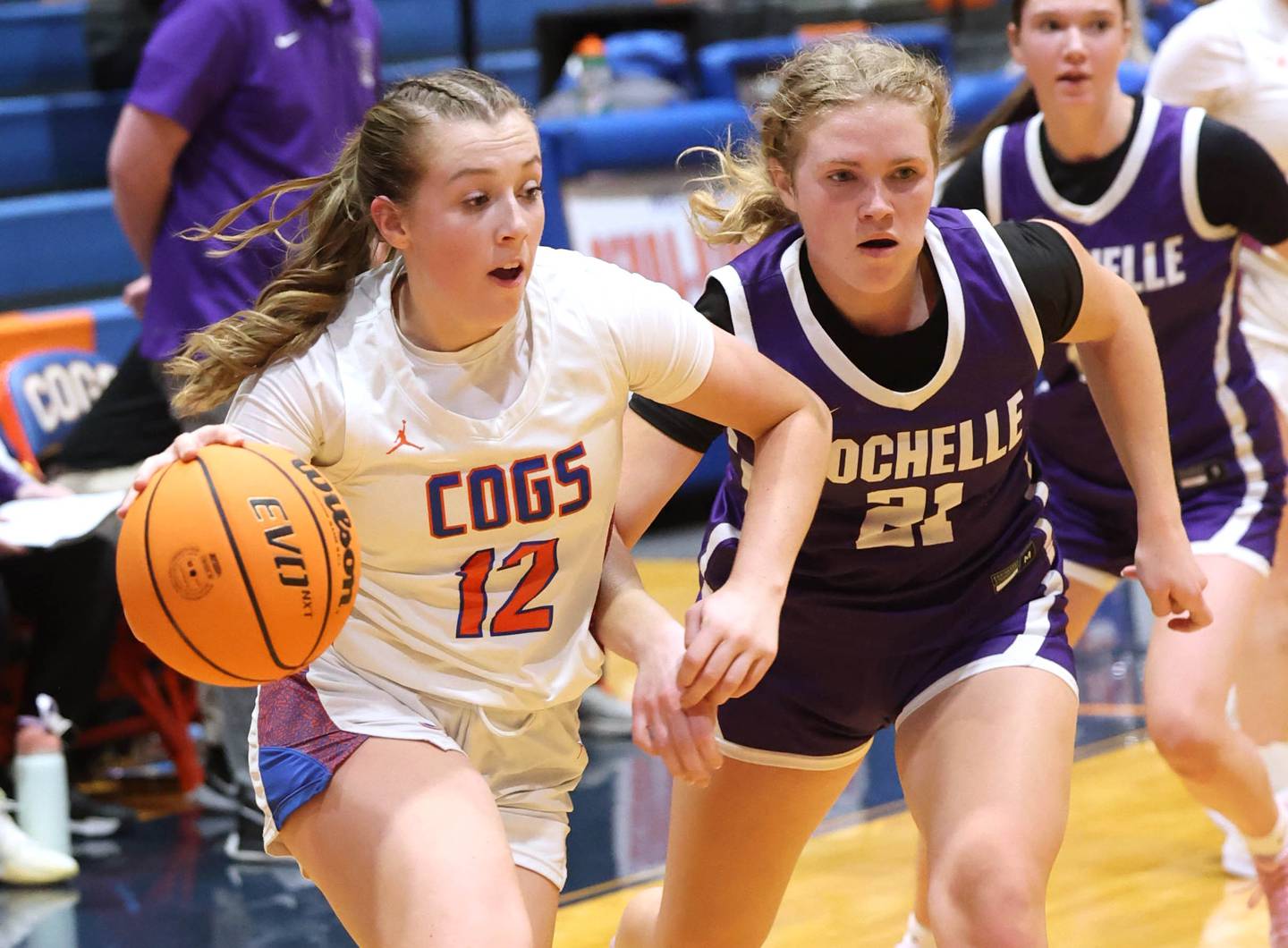 Genoa-Kingston's Ally Poegel drives by Rochelle's Abby Metzger during their game Monday, Dec. 16, 2024, at Genoa-Kingston High School.