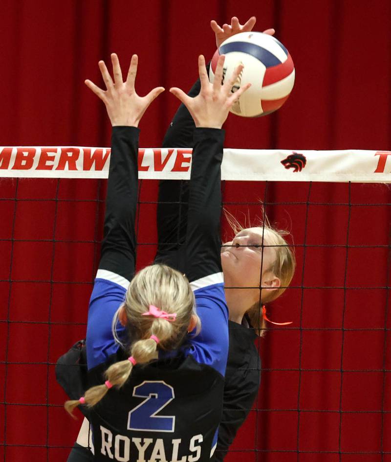 Indian Creek's Allie Peterson tries to spike the ball by Hinckley-Big Rock's Anna Herrmann during their Class 1A regional play-in game Monday, Oct. 28, 2024, at Indian Creek High School in Shabbona.