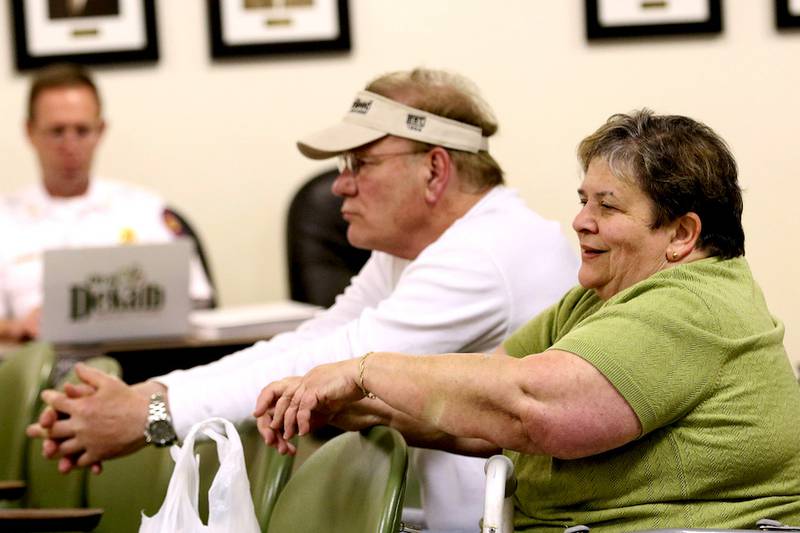 Bessie Chronopoulos, sitting next to Jim Mason (left), shakes her head in reaction to a motion made during a Planning and Zoning Commission meeting Wednesday at the DeKalb Municipal Building. "I don't think they should increase the density of the property," Chronopoulos said in regard to University Village. The seven-member advisory commission voted 4-3 Wednesday against a key provision of the zoning change regarding density, but the commission failed to take a decisive up or down vote on the entire request. The zoning change would allow Seattle-based Security Properties to buy the complex and undertake an $18 million renovation project.