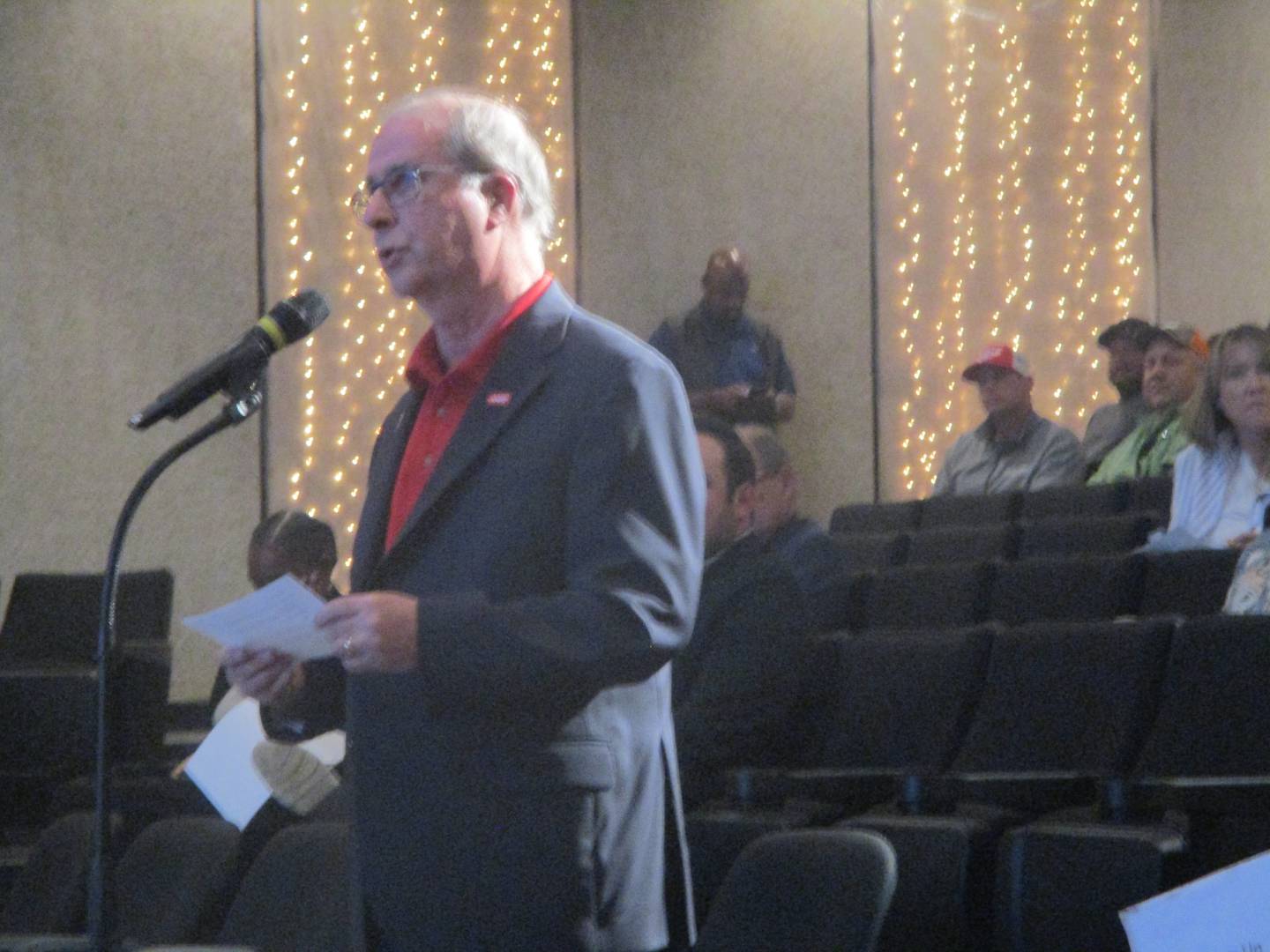 Al Hollenbeck with Illinois AARP speaks against a Nicor Gas rate increase during a hearing held Monday at Billie Limacher Bicentennial Park in Joliet. The hearing was scheduled due to a request filed by AARP. June 9, 2025