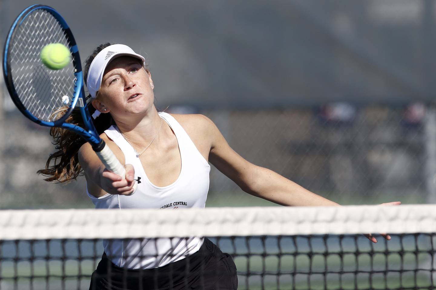 Hinsdale Central's Katie Dollens hits the ball back to Lake Forest during the girls state tennis 2A doubles final at Buffalo Grove High School on Saturday, Oct. 23, 2021 in Buffalo Grove.