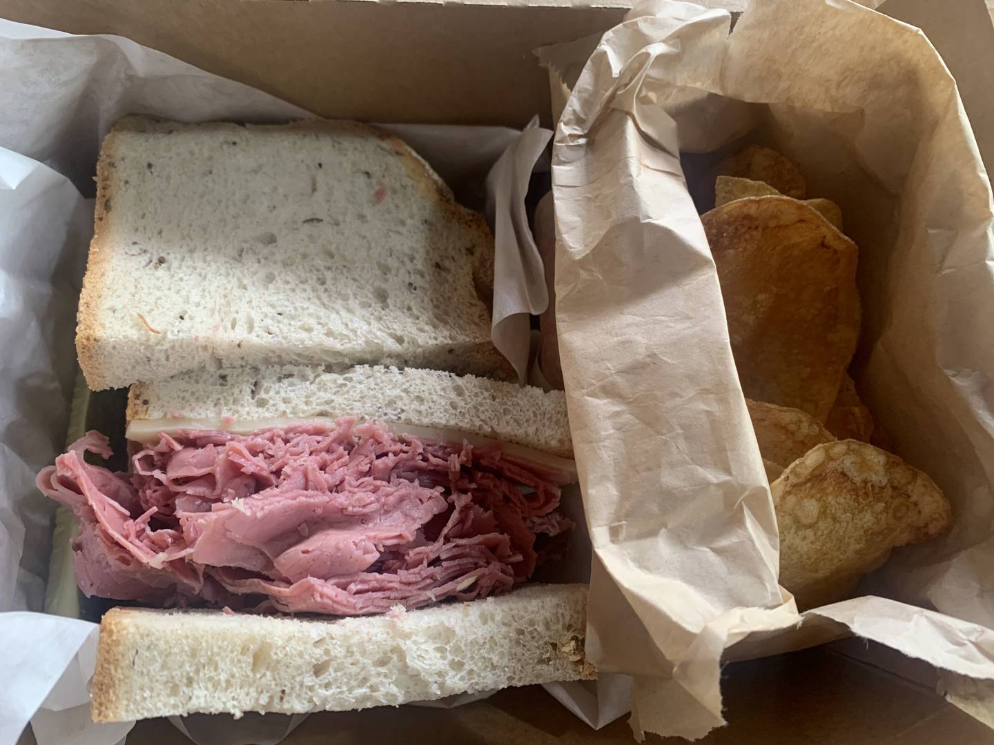 The Tom & Jerry Combo at the Corned Beef Factory in Woodstock comes with corned beef, pastrami and Swiss cheese on rye bread.