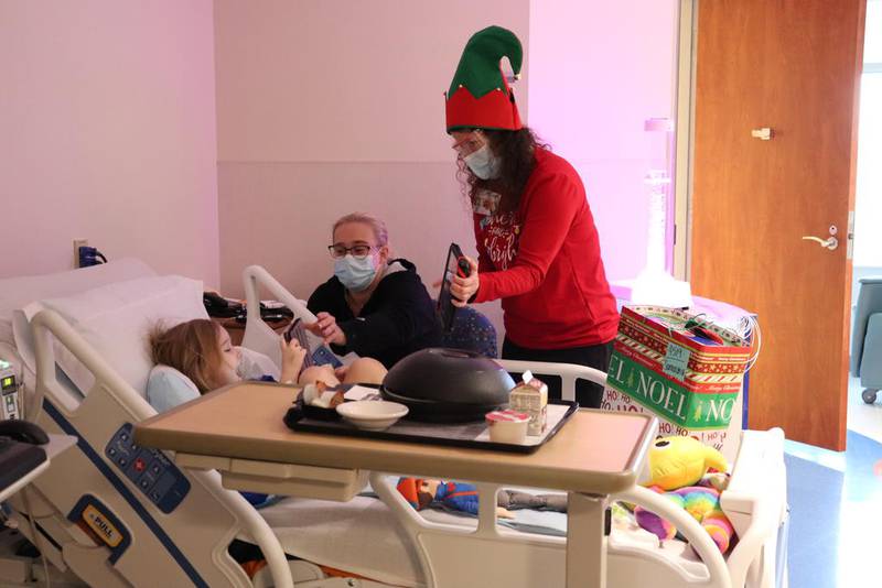 Samarah Nowak, 4, of Geneva receives a virtual visit from Santa and gifts from his "elves" while at Northwestern Medicine Central DuPage Hospital on Dec. 10.