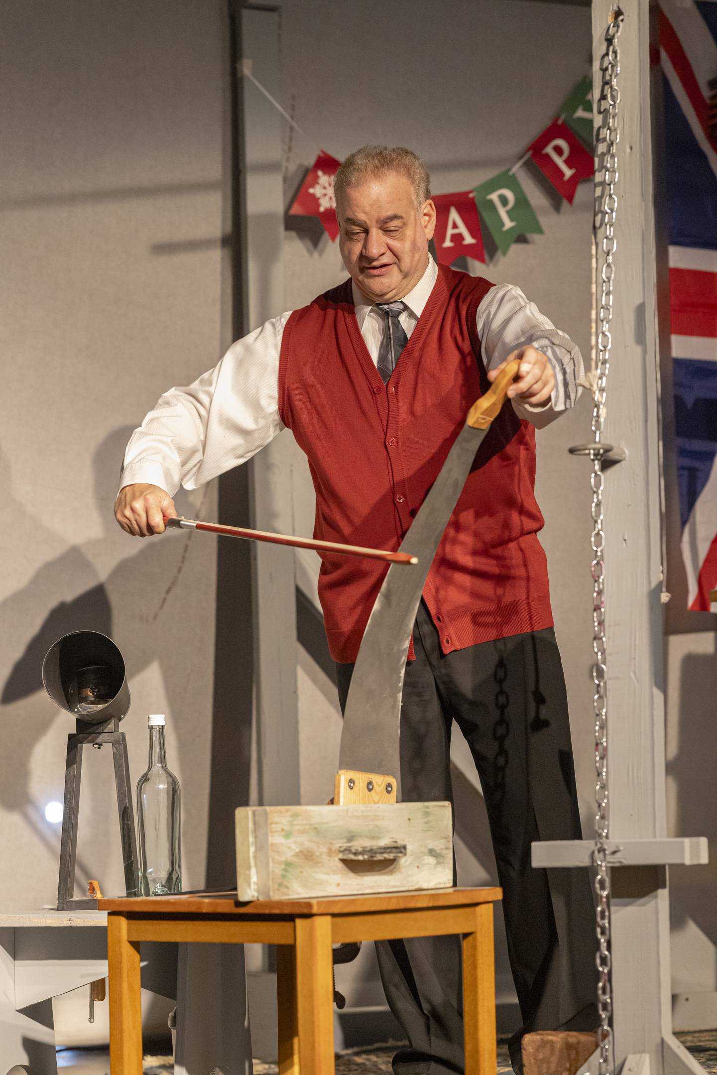 Jeff Sudakov uses a saw and violin bow to produce sound effects during a rehearsal of the show, "A Christmas Carol: The Ghosts of Christmas" during rehearsals Nov. 23, 2024, at Stage 212 in La Salle. Tickets for Her Majesty's Radio Theatre presents “A Christmas Carol: The Ghosts of Christmas” are $17 each. Tickets may be purchased online by visiting stage212.org or by calling the box office at 815-224-3025 and leaving a message.