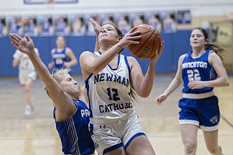 Newman’s Lucy Oetting goes hard to the hoop against Princeton Thursday, Dec. 14, 2023 at Newman High School.