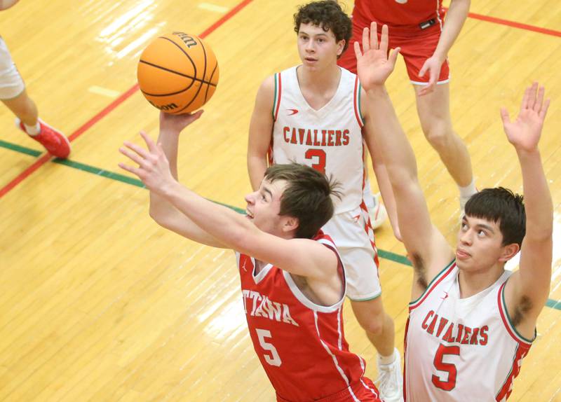 Ottawa's Klyer Araujo eyes the hoop as L-P's Erick Sotelo defends on Friday, Feb. 7, 2025 in Sellett Gymnasium at L-P High School.