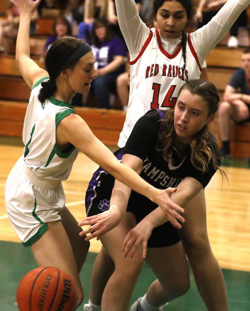 Hampshire's Whitney Thompson passes out of the double team of Alden-Hebron’s Evelyn Heber and Huntley's Yasmine Morsy during the girl’s game of McHenry County Area All-Star Basketball Extravaganza on Sunday, April 14, 2024, at Alden-Hebron’s Tigard Gymnasium in Hebron.