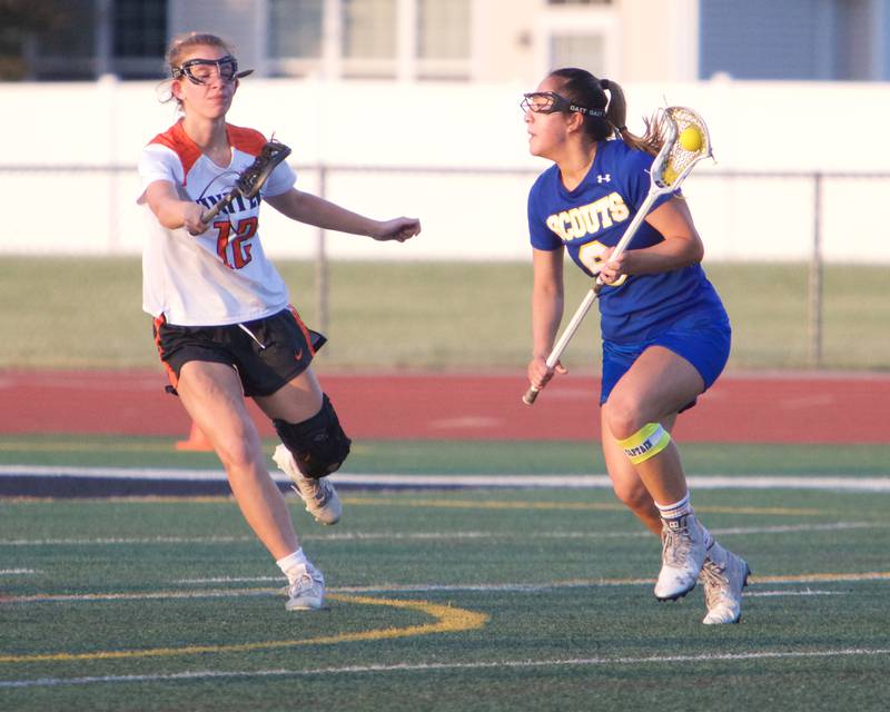 Crystal Lake Central's Payton Seibert defends Lake Forest's Chelsea Tzau at the Super Sectional Final on Tuesday, May 30, 2023 in Huntley.