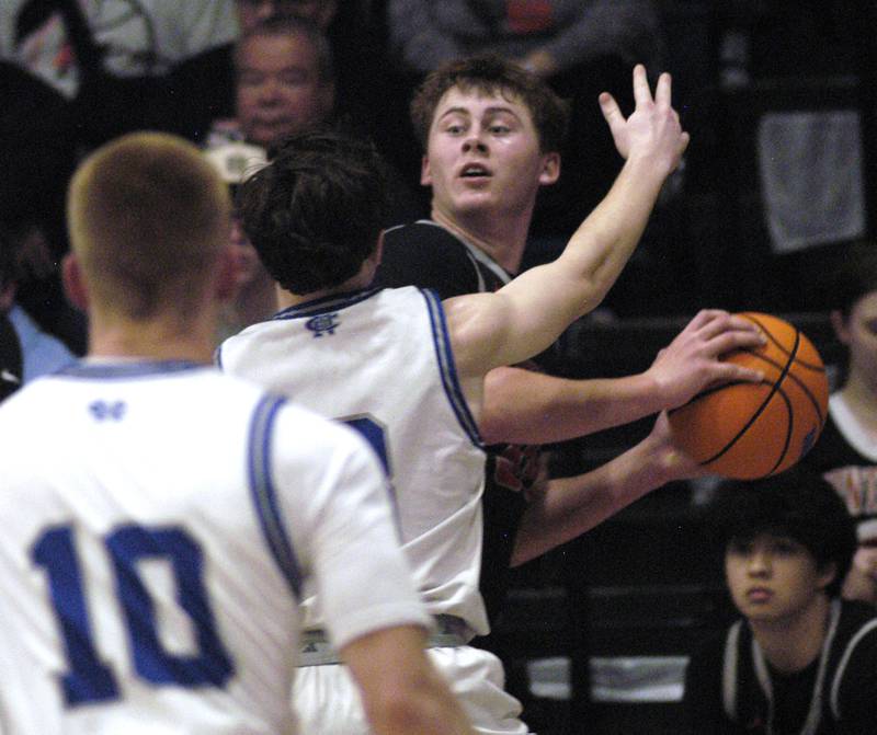 Erie-Prophetstown's Evan Steimle is surrounded by Newman's defense.  The Newman Comets hosted the Erie-Prophetstown Panthers in a Conference game. played at Newman High School on February 6, 2026.
