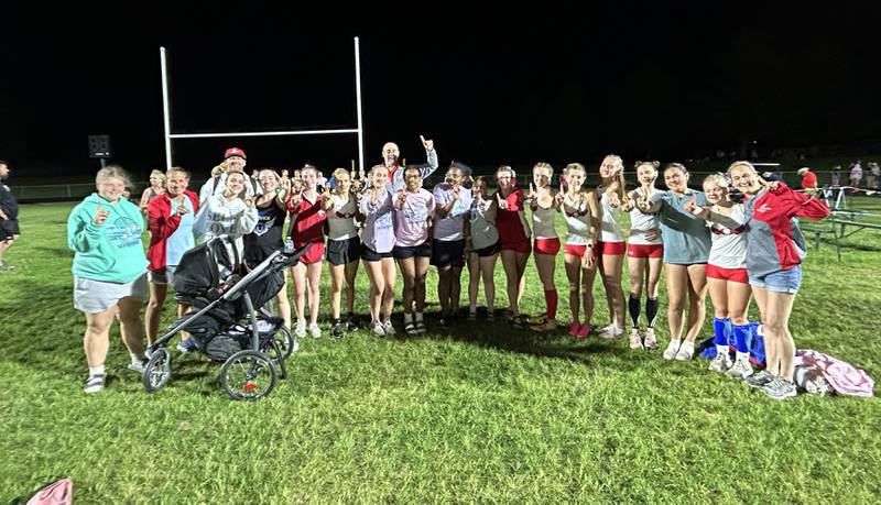 Oregon track and field team members and their coaches celebrate after winning the 1A Lena-Winslow sectional on Thursday, May 15, 2025.