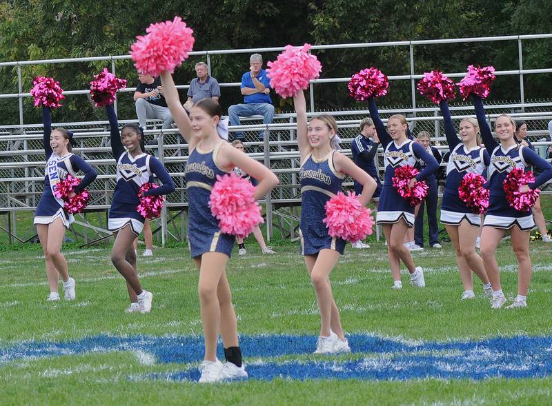 The Marquette Crusader Cheerleaders and Poms rev up the crowd up before Saturday’s game against Knoxville High School at Marquette