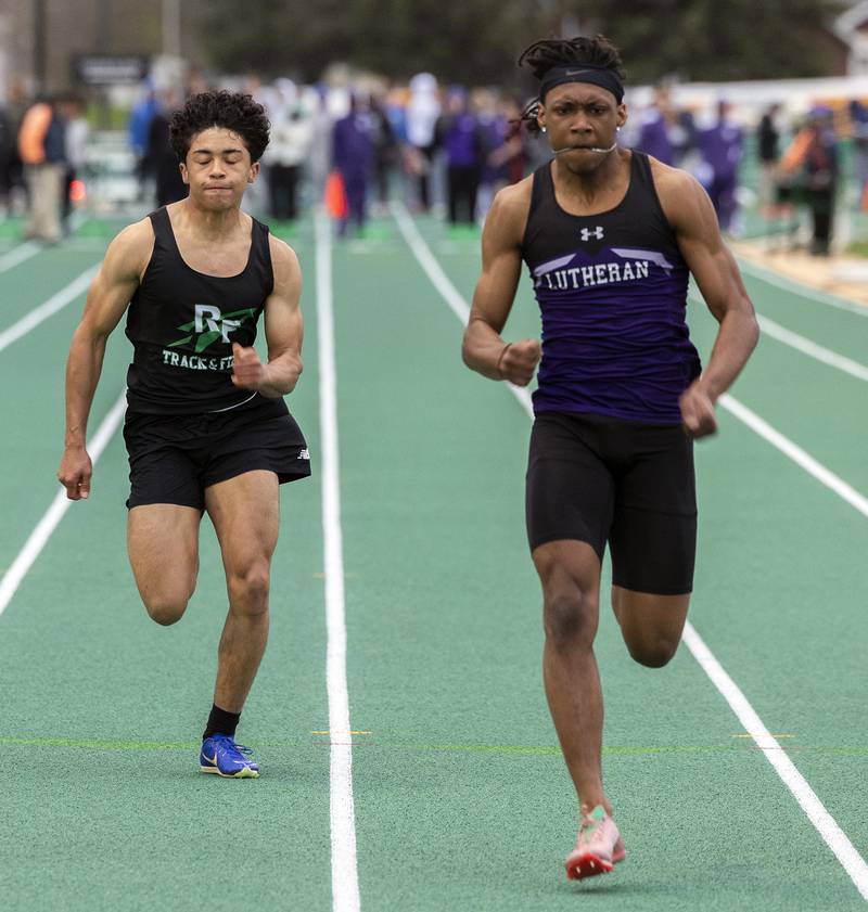 Rock Falls’ Alexavier Oquendo and Rockford Lutheran’s David Ballard fight for the win in the 100 dash Friday, April 25, 2025, during the Rock Falls Rocket Invite.