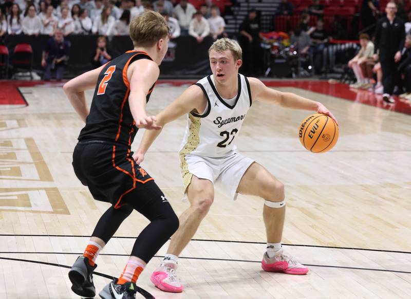 Sycamore's Carter York works against DeKalb's Sean Reynolds during their game Friday, Jan. 31, 2025, in the FNBO Challenge in the Convocation Center at Northern Illinois University in DeKalb.