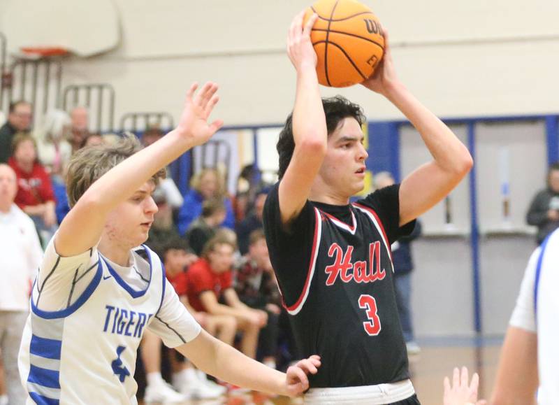 Hall's Noah Plym looks to pass the ball around Princeton's Julian Mucha on Friday, Feb. 13, 2026 at Princeton High School.