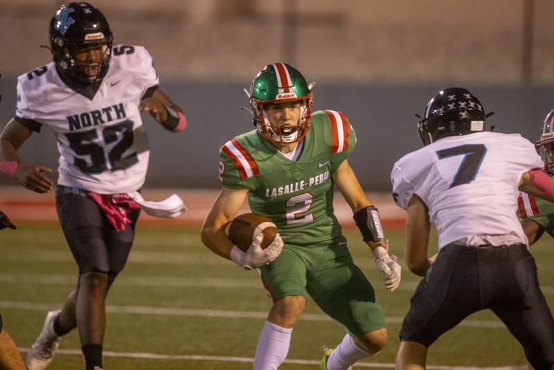 Lasalle-Peru's Seth Adams (2) attempts to get by Woodstock North Thunder's George Kingos during the game at Howard Fellows Stadium on Sept. 8, 2023.