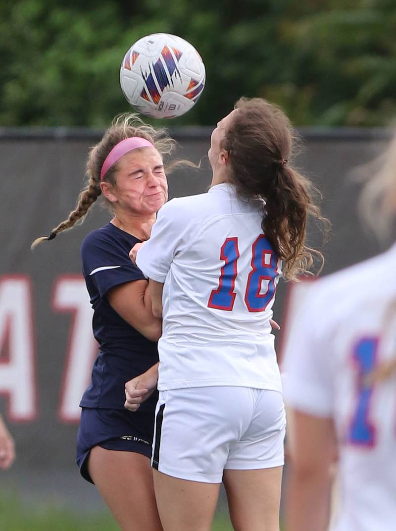IC Catholic Prep's Kelsey McDonough and Pleasant Plains' Brookelyn Hermes collide going for a header during the IHSA Class 1A state girls soccer third place game Saturday, May 27, 2023, at North Central College in Naperville.
