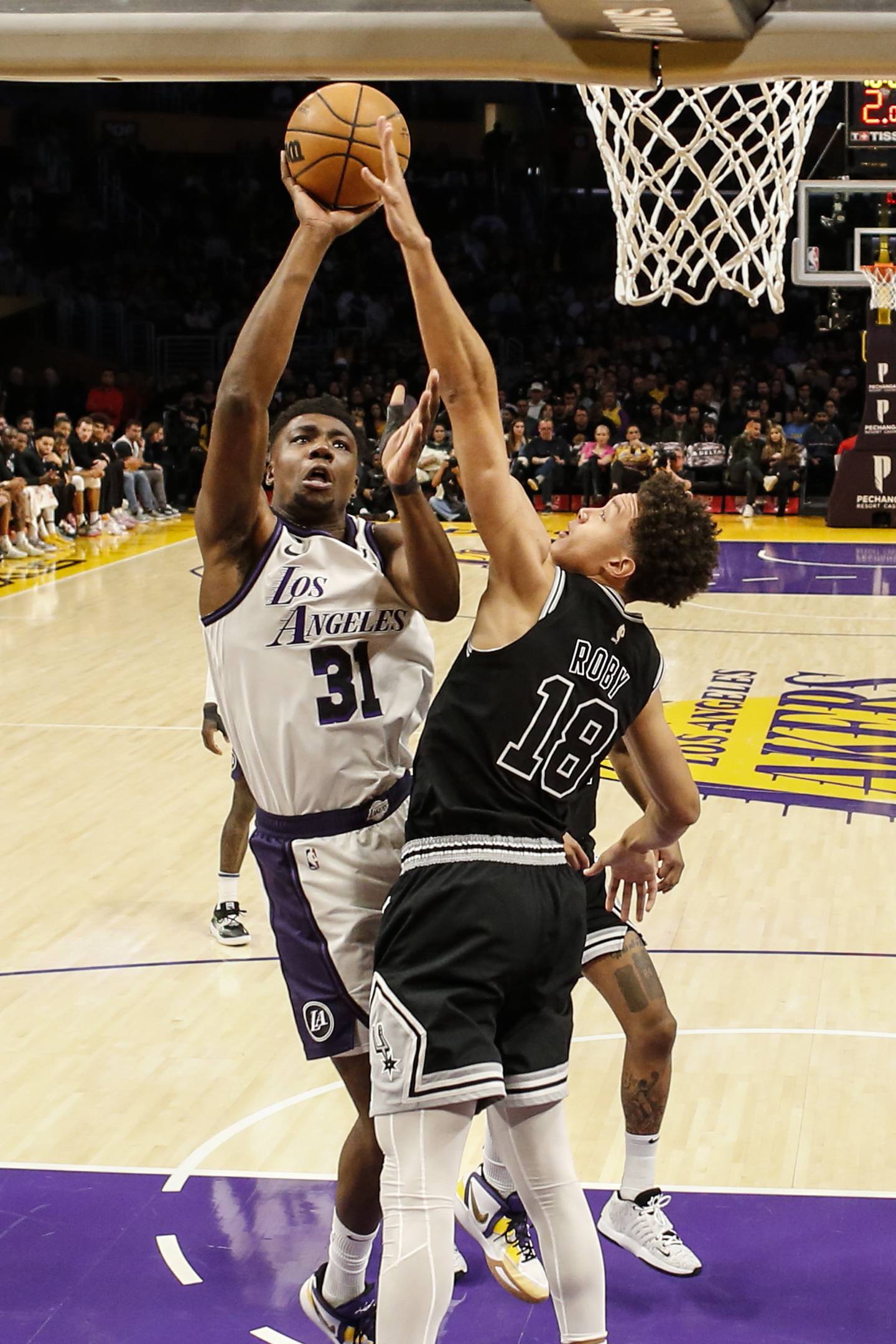 Los Angeles Lakers center Thomas Bryant (31) shoots against San Antonio Spurs forward Isaiah Roby (18) during the first half of an NBA basketball game Sunday, Nov. 20, 2022 in Los Angeles. (AP Photo/Ringo H.W. Chiu)