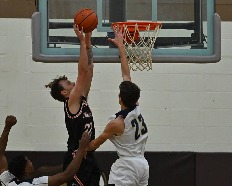 Minooka's Nick Andreano (22) goes up for a layup in the WJOL Basketball Tournament on Monday, November 21, 2022, at Joliet.