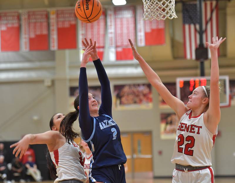 Nazareth’s Samantha Austin (2) shoots from between Benet’s Emma Briggs and Bridget Rifenburg (22) during a game on January 28, 2026 at Benet Academy in Lisle.