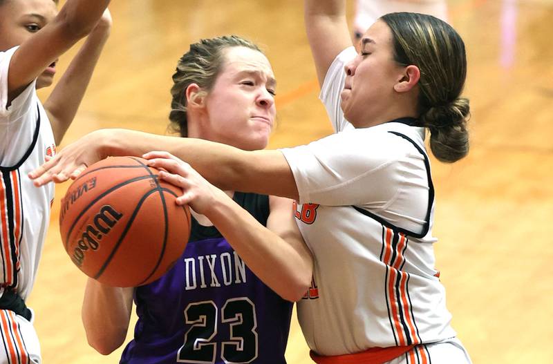 DeKalb's Ari Smith blocks Dixon’s Hannah Steinmeyer’s shot during their game Monday, Jan. 23, 2023, at DeKalb High School.