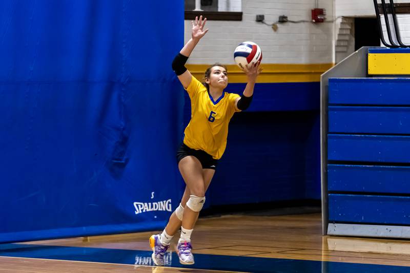Joliet Central's Camryn Brown serves during a varsity volleyball home game against Lisle on Sept. 22, 2025.