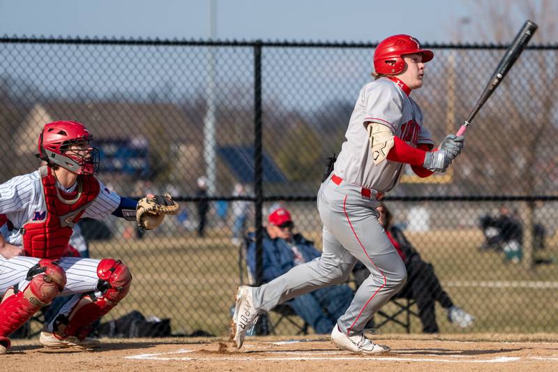 Yorkville's Kam Yearsley (17) singles driving in a run against Marmion during a baseball game at Marmion High School in Aurora on Tuesday, Mar 28, 2023.