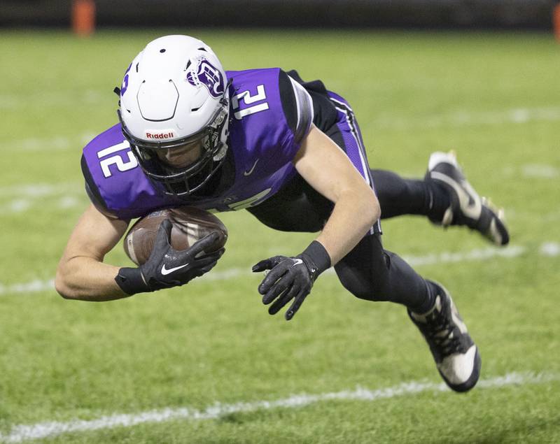 Dixon’s Jackson Koehler hauls in a catch against Woodstock North Friday, Oct. 31, 2025, in the Class 4A football first round playoffs.