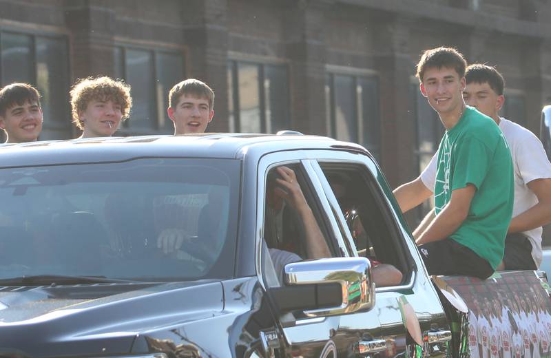 Members of the L-P boys basketball team ride a float during the L-P homecoming parade on Thursday, Oct. 2, 2025 downtown Peru.