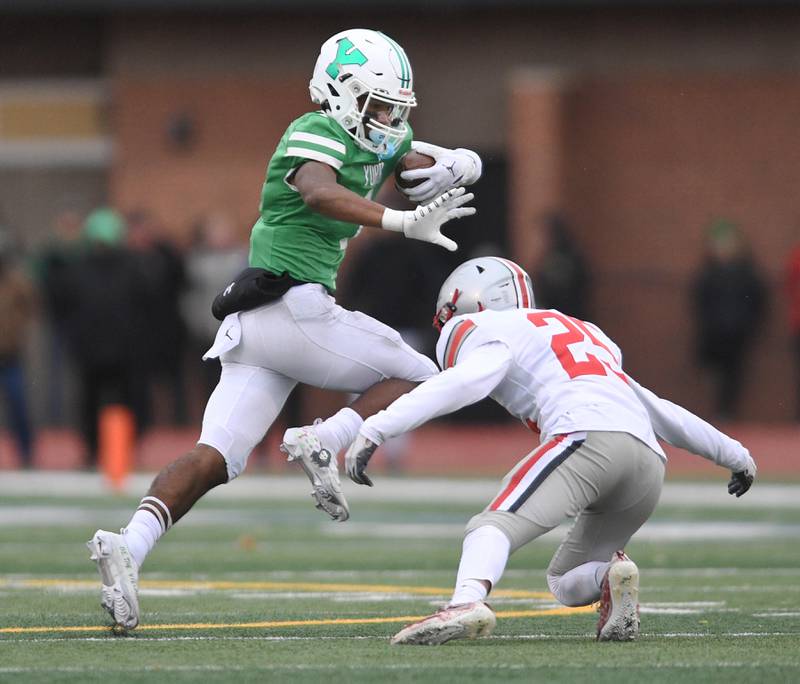 York’s Kelly Watson tries to get past Palatine’s Michael Tokar in a Class 8A quarterfinal playoff football game in Elmhurst on Saturday, November 12, 2022.