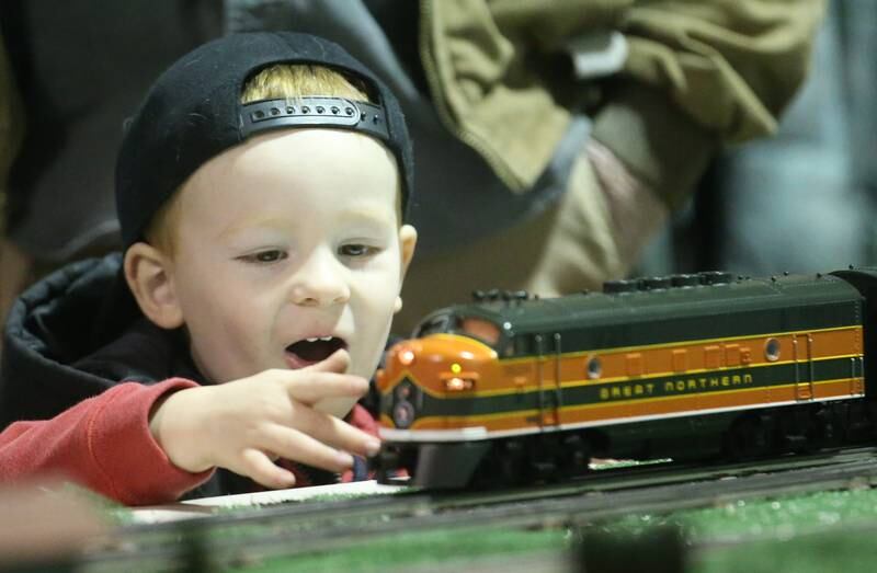Jackson Holmbeck 3, of Granville, touches a Lionel O Scale locomotive during the Model Train Fair and Farm Toy Show on Saturday, Feb. 17, 2024 at the Bureau County Fairgrounds in Princeton.