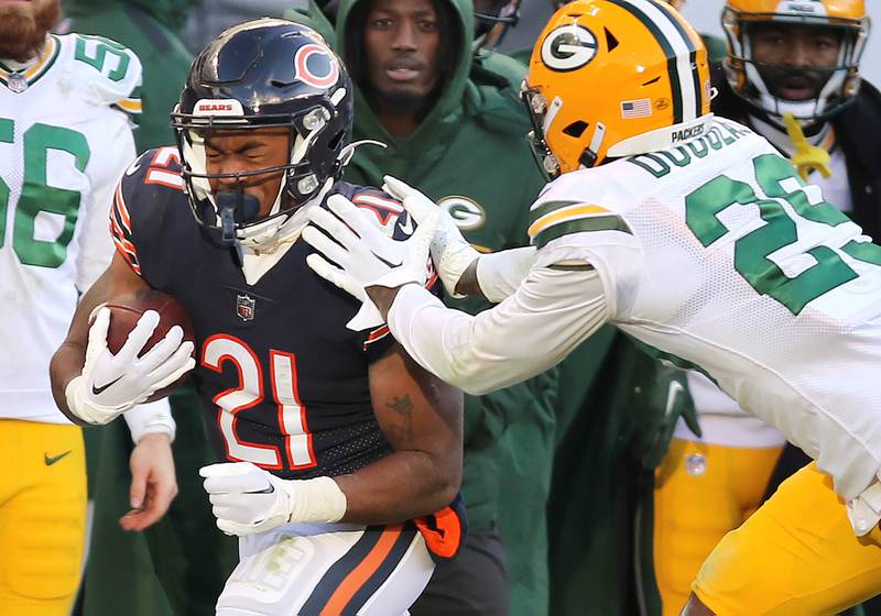 Chicago Bears running back Darrynton Evans is pushed out of bounds by Green Bay Packers cornerback Rasul Douglas during their game Sunday, Dec. 4, 2022, at Soldier Field in Chicago.