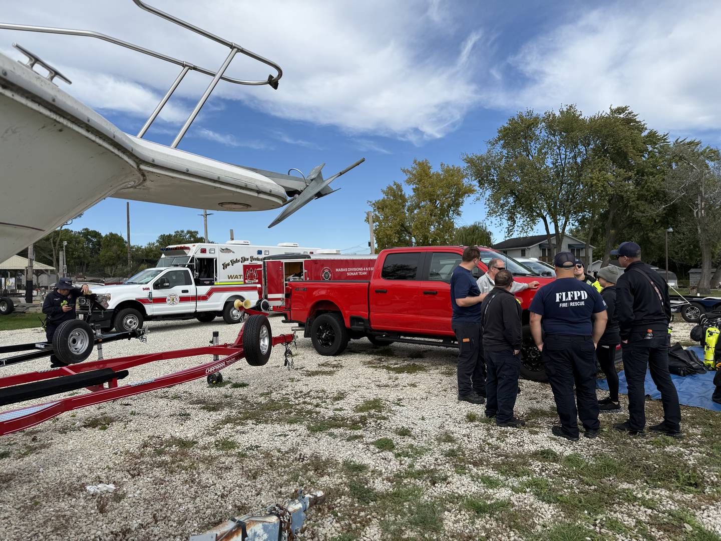 Searchers from the Antioch Fire Protection District and Illinois Department of Natural Resources continue to search on Tuesday, Oct. 7, 2025, on Fox Lake near Antioch for a man thrown from a boat he was test driving Monday night.