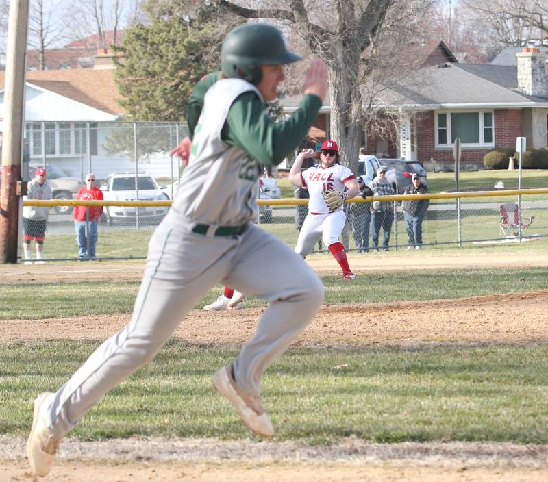 Hall's Joel Koch throws out St. Bede's Alan Spencer while running to first base on Monday, March 27, 2023 at Kirby Park in Spring Valley.