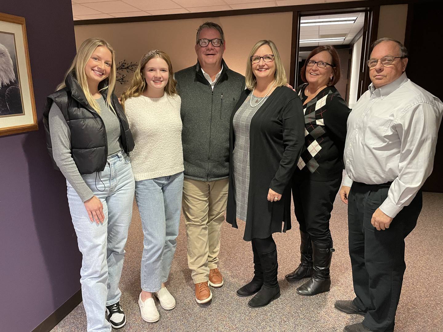 Celebrating Tracy Morris’ achievement are daughters Zoe (left) and Caroline, husband Mike, Morris, and parents Nancy and Don Burress.