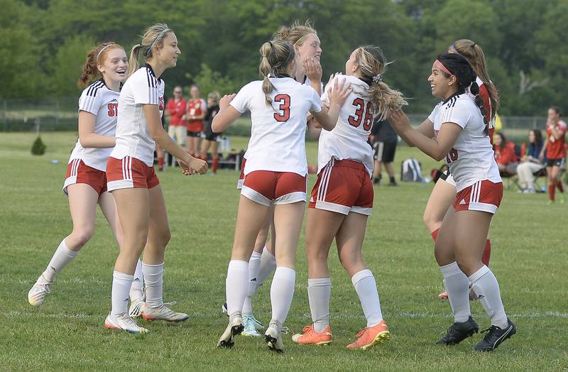 The Lady Bulldogs celebrate a goal by Anna Russow tying up the match 2-2 during the Class 2A Regional championship on Friday, May 19, 2023 in Streator.