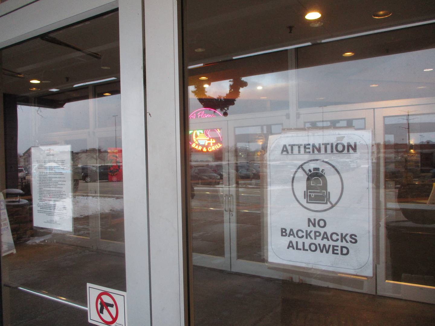 Notices of prohibitions, including a 10-rule Code of Conduct that among other things  bars juveniles unaccompanied by adults during certain hours, are posted at an entrance to the Louis Joliet Mall. Dec. 29, 2025