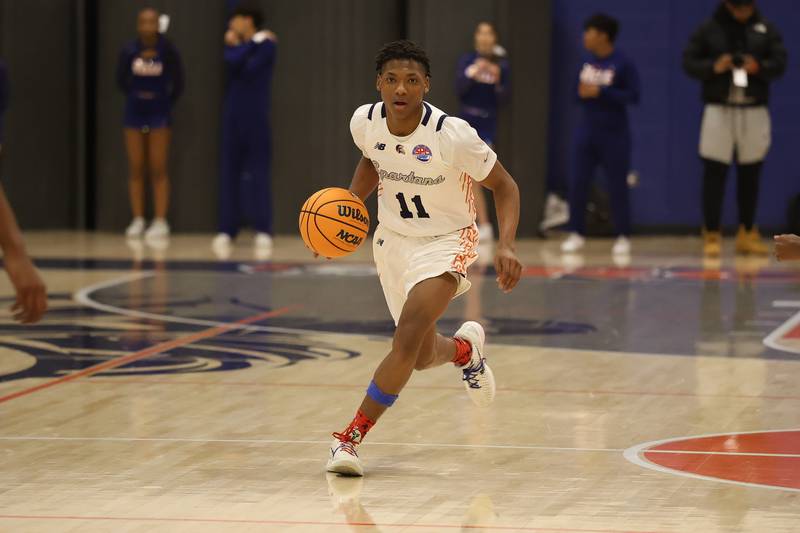Romeoville's Jamarri Fears works the ball upcourt against Bolingbrook on Tuesday, Dec. 2, 2025 in Romeoville.